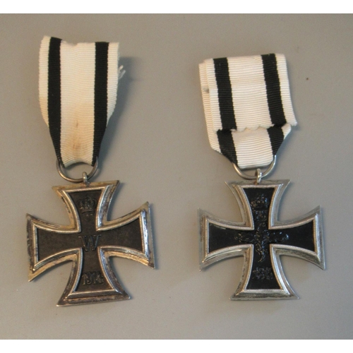 98 - Two German Iron Crosses (second class), both with non combatants ribbons. (2)
(B.P. 21% + VAT)