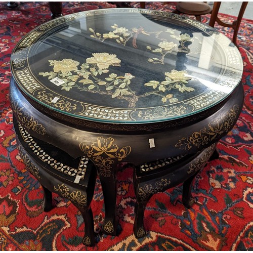 509 - Chinese lacquered mother of pearl inlaid nest of 5 tables - the top decorated with flowers and birds... 