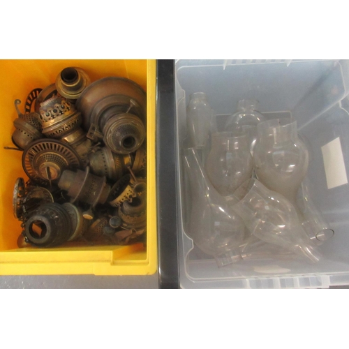 408 - 2 Boxes of oil lamp bases, parts and clear glass chimney.  
(B.P. 21% + VAT)