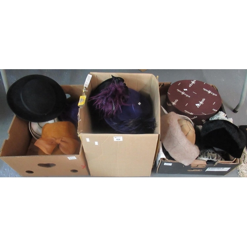 424 - Three boxes of various hats: felt hats, Chesterfield linen hat with roses, Siggi pillbox hate with p... 