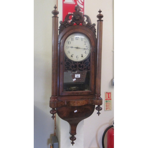 490 - Late Victorian walnut two-train wall clock with painted Arabic face and fox mask moulded pediment.
(... 