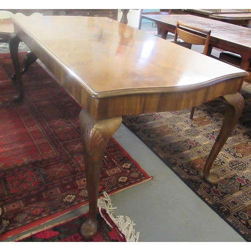 497 - Early 20th century walnut serpentine shaped table on carved shell and cabriole legs with pad feet.
 ... 