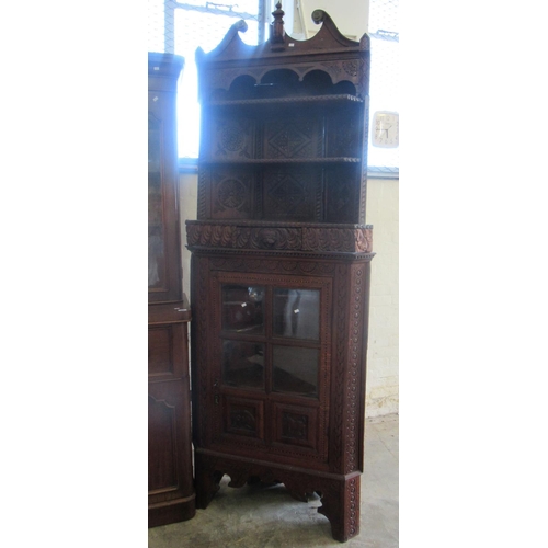 505 - Late Victorian oak heavily carved, ornate standing corner cabinet with shaped oak shelves to the int... 