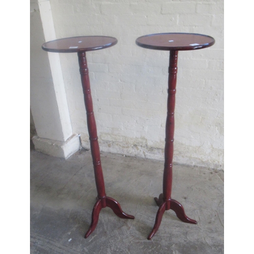 507 - A pair of stained mahogany tripod torchere stands (2)  
(B.P. 21% + VAT)