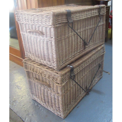 522 - Pair of wicker two handled laundry baskets with cast metal mounts and swing handles.  (2)
 (B.P. 21%... 