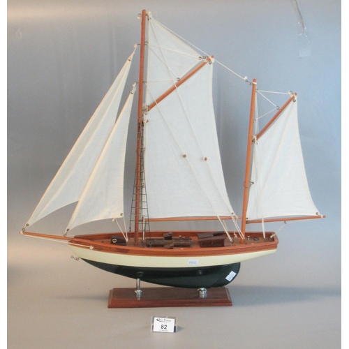 82 - Well made model of a two-masted Cutter on a rectangular base. 57cm high approx overall.
(B. P. 21% +... 