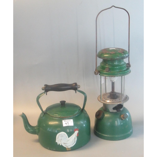 93 - Tilley-type enamelled metal hurricane lamp, together with a painted metal teapot decorated with a wh... 