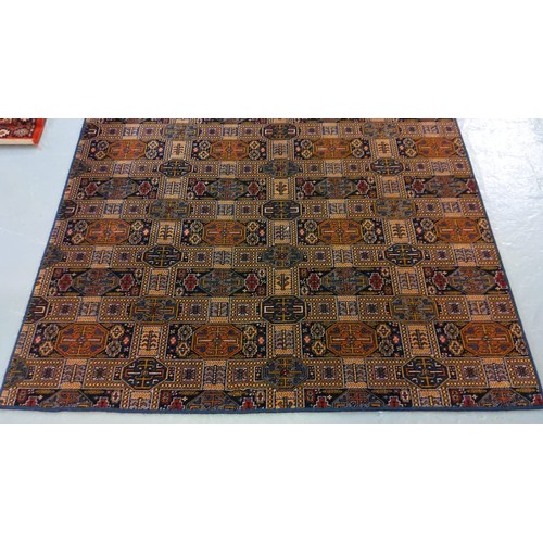 529 - Modern middle eastern design carpet on a multicoloured geometric and foliate ground.  410x172cm appr... 