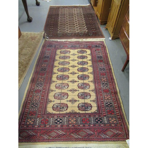 527 - 2 Similar middle eastern design rugs with central medallion designs, together with another beige gro... 