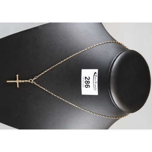 286 - 9ct gold crucifix on chain.  Approx weight 3 grams.
(B.P. 21% + VAT)