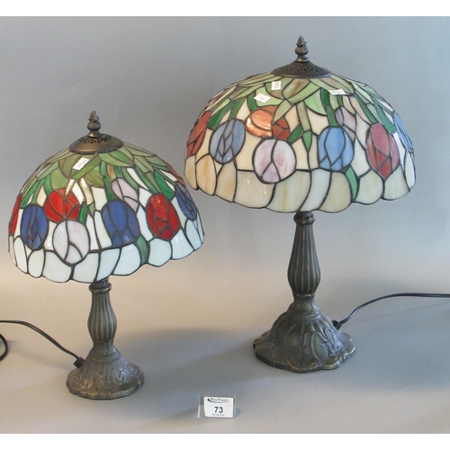 73 - Two similar reproduction Tiffany style mushroom lamps with lead glazed shades on bronzed bases. 47cm... 