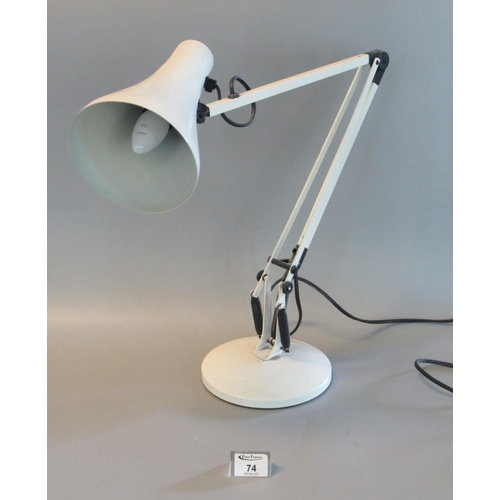 74 - Angle poise white enamelled reading lamp on circular base.
(B.P. 21% + VAT)