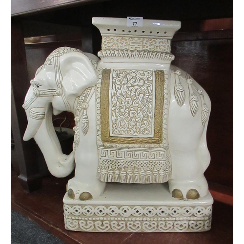 77 - Large ceramic garden seat in the form of Caparisoned elephant on rectangular base. 60cm high approx.... 