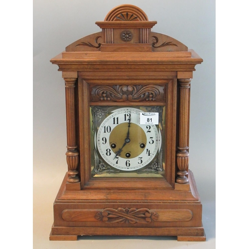 81 - Early 20th century walnut three train architectural mantel clock with German movement, striking on f... 