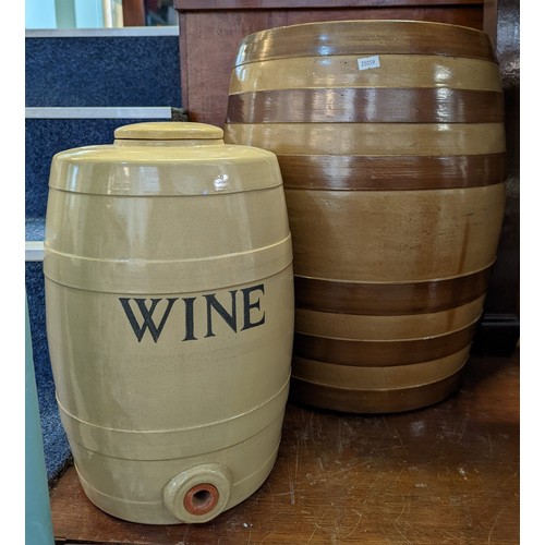 80 - Large earthenware barrel and another ceramic barrel with lid labelled 'WINE'. The largest 47cm high ... 