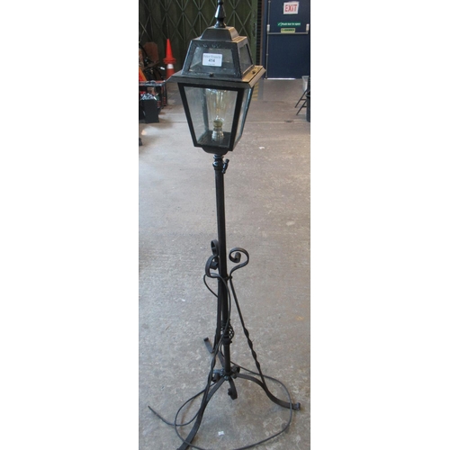 414 - Wrought iron standard lamp with street lantern type top.
(B.P. 21% + VAT)