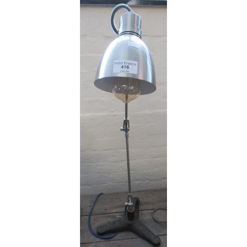 416 - Brushed steel angle poise type desk lamp with cast iron triform base.
(B.P. 21% + VAT)