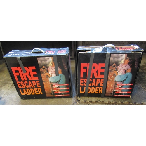 434 - Two 25ft fire escape ladders appearing in original boxes. (2)
(B.P. 21% + VAT)