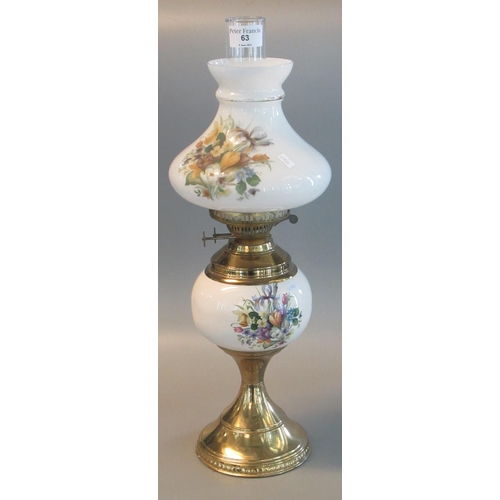 63 - 20th century double oil burner lamp having opaline glass floral shade and reservoir on a brass base.... 