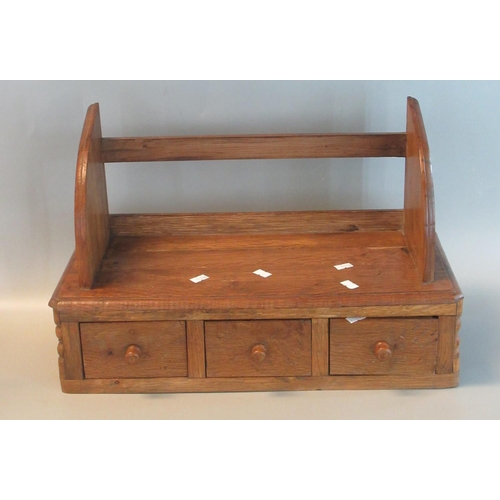 64 - Small oak wall shelving unit having a bank of three drawers with turned handles.  (B.P. 21% + VAT)