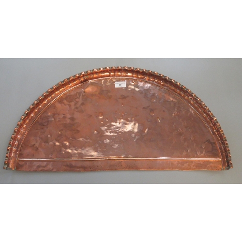 69 - 19th century half moon beaten copper tray with waved edge.
(B.P. 21% + VAT)