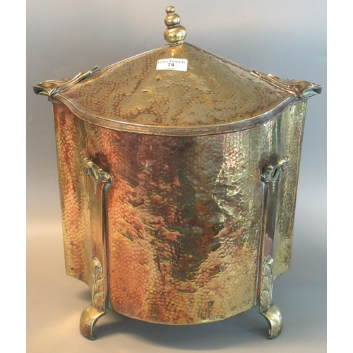 74 - Art Nouveau design beaten brass lidded coal or log bin, with shaped feet.
(B.P. 21% + VAT)