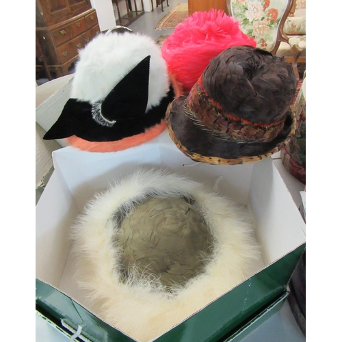 436 - A collection of good quality vintage and designer hats in hat boxes, to include: a pheasant feather ... 