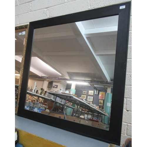 452 - A modern, black finish framed wall mirror of square form 125x125cm approx.  (B.P. 21% + VAT)