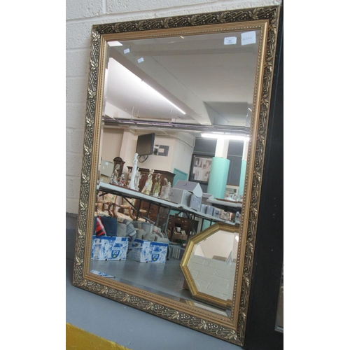 453 - Modern gilt framed, bevel plate mirror, the frame with moulded leaf and berry decoration.  71x104cm ... 