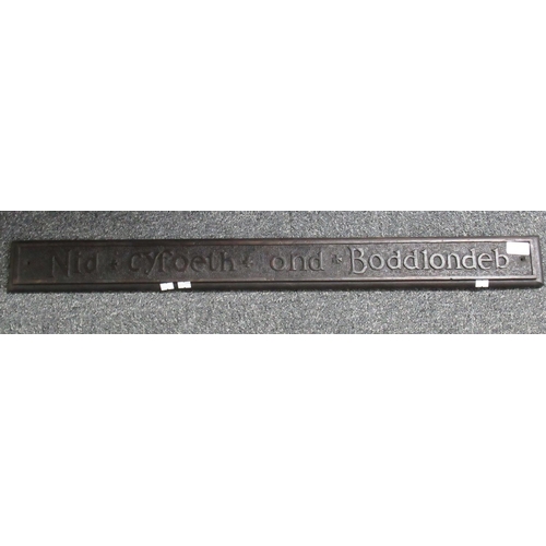 85 - Carved rectangular wooden motto board ' Nid Cyfoeth Ond Boddlondeb' 91cm long approx.  (B.P. 21% + V... 