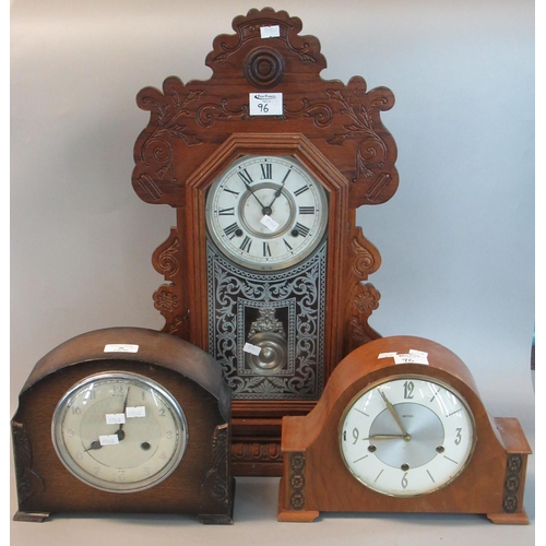 96 - Early 20th century Ansonia two train Gingerbread type mantle clock together with two hat shaped mant... 