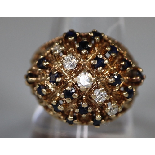 218 - 9ct gold diamond and sapphire cluster ring.  Ring size Q.  Approx weight 8g. 
(B.P. 21% + VAT)