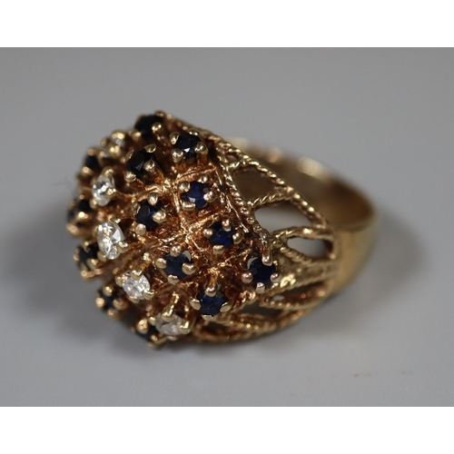 218 - 9ct gold diamond and sapphire cluster ring.  Ring size Q.  Approx weight 8g. 
(B.P. 21% + VAT)