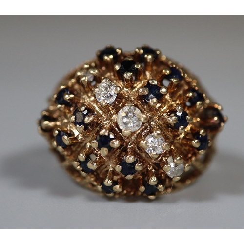 218 - 9ct gold diamond and sapphire cluster ring.  Ring size Q.  Approx weight 8g. 
(B.P. 21% + VAT)