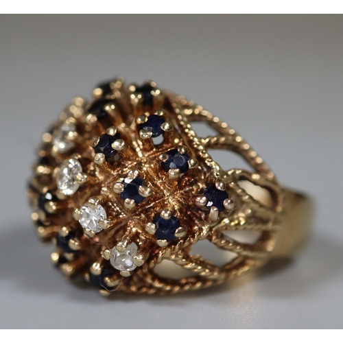 218 - 9ct gold diamond and sapphire cluster ring.  Ring size Q.  Approx weight 8g. 
(B.P. 21% + VAT)