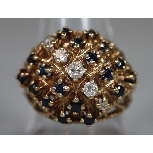 218 - 9ct gold diamond and sapphire cluster ring.  Ring size Q.  Approx weight 8g. 
(B.P. 21% + VAT)