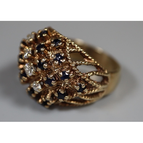 218 - 9ct gold diamond and sapphire cluster ring.  Ring size Q.  Approx weight 8g. 
(B.P. 21% + VAT)