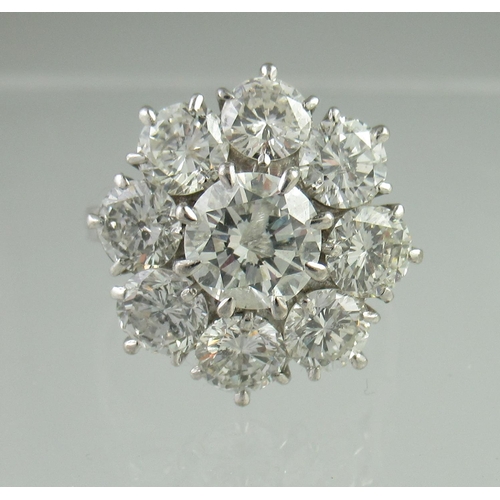 233 - Diamond cluster ring of a central brilliant cut diamond surrounded by eight brilliant cut diamonds. ... 