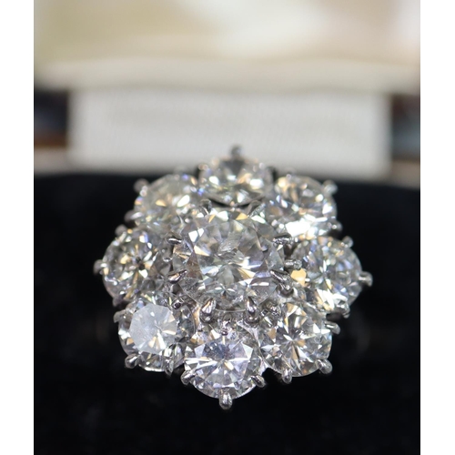 233 - Diamond cluster ring of a central brilliant cut diamond surrounded by eight brilliant cut diamonds. ... 