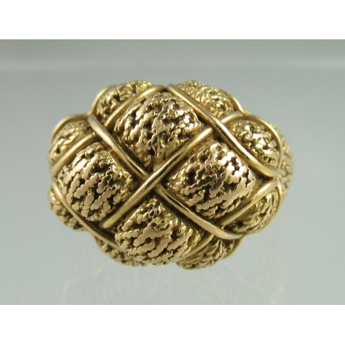 238 - A yellow metal ring heavily engraved and shaped with basketwork shoulders.  Ring size P.  Engraved t... 