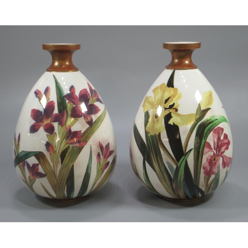 144 - A pair of Victorian Doulton Burslem vases, hand-painted with irises, dated 1883, with painters mark ... 