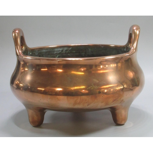 151 - Heavy Chinese baluster shaped bronze censer, with two loop handles on three short feet.  Impressed g...