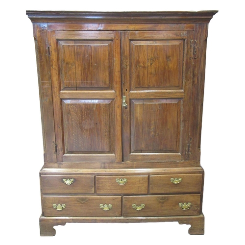 16 - Early 19th century Welsh oak two stage blind panelled press cupboard, the moulded cornice above two ... 