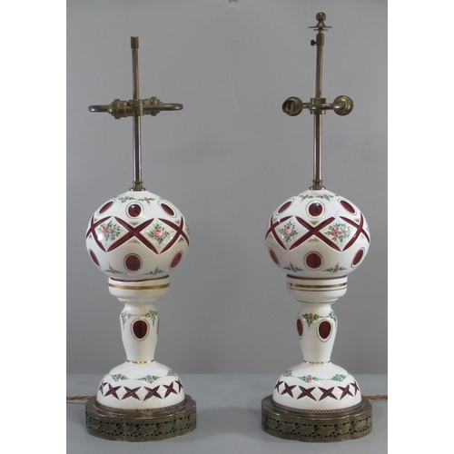 173 - Pair of late 19th century Bohemian overlay  cranberry glass table lamps, hand-painted with enameled ... 