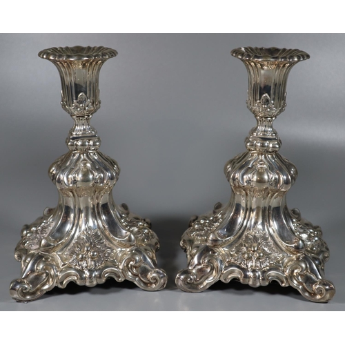 203 - A pair of  Danish silver filled candle sticks ornately decorated with moulded scrolls, foliage and b... 