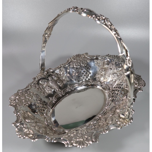 208 - Late Victorian silver fruit basket with single swing handle having pierced borders and embossed frui... 