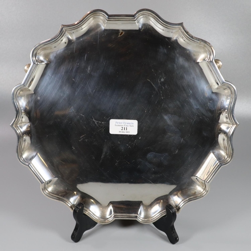 211 - Edward VII silver salver of pie crust form standing on three hoof feet by C S Harris & Sons Ltd Lond... 