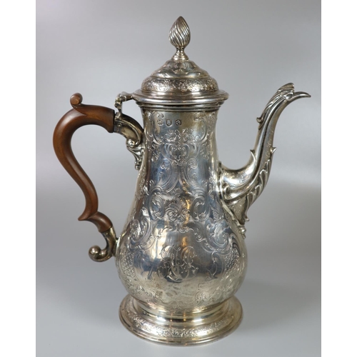 215 - George III silver coffee pot having chased floral and foliate decoration overall with turned wooden ... 