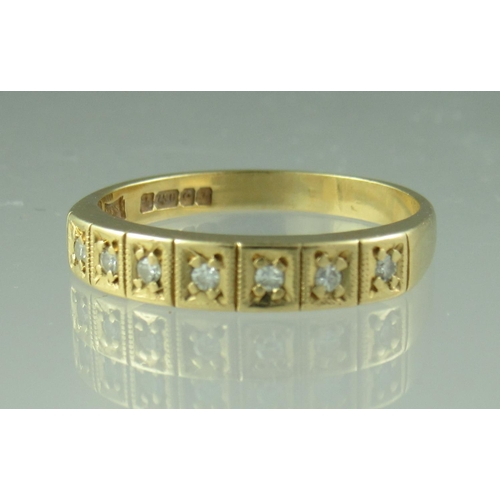 223 - A diamond half eternity style ring set in 18ct gold.  Ring size M & 1/2.  Approx weight 2.7 grams.
 ... 