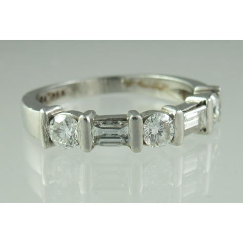 228 - A diamond half eternity style ring set with three brilliant cut and two baguette cut diamonds.  Ring... 